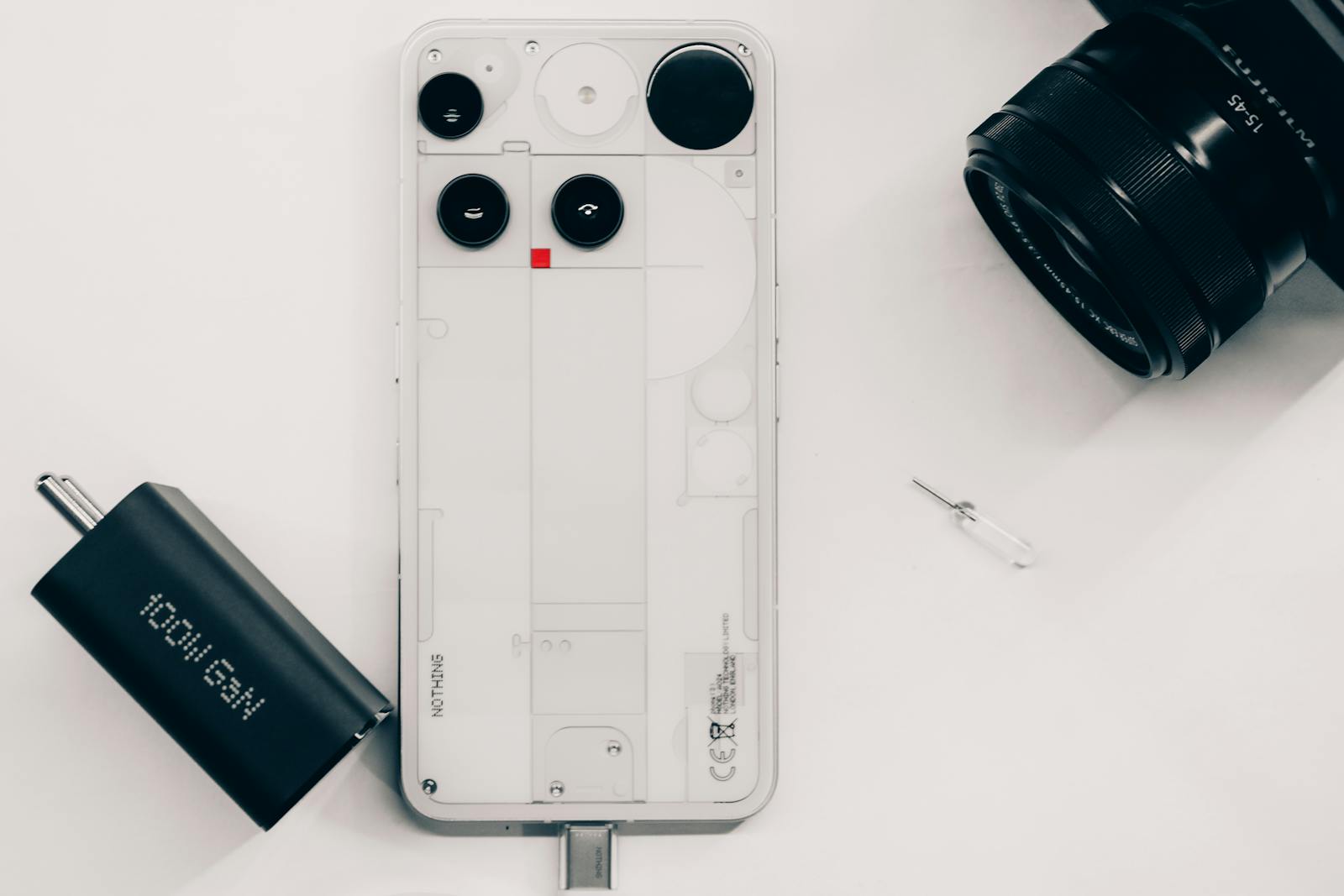 Real mobile accessories arranged as a flat lay kit